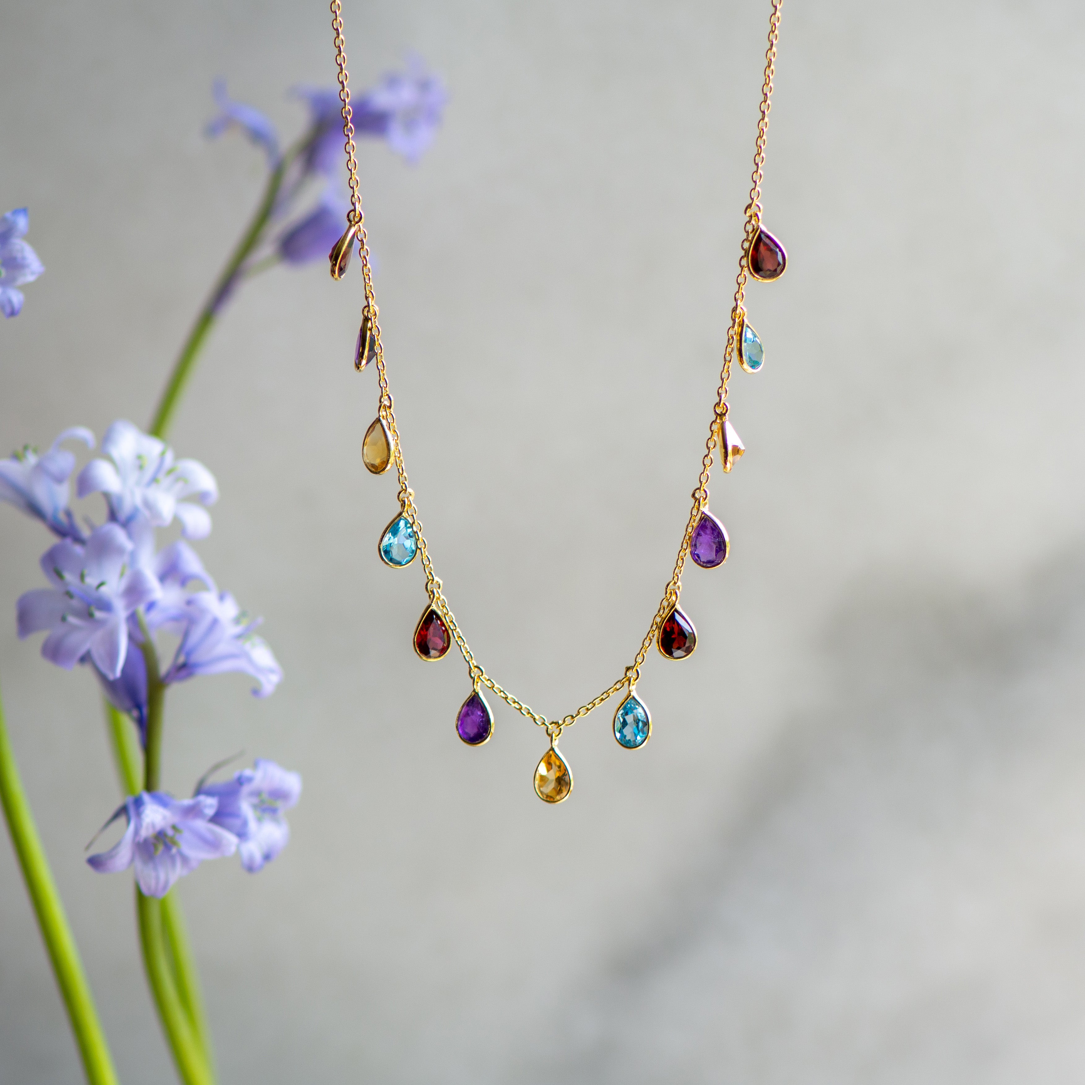 pear drop gold necklace with multiple stones from memara
