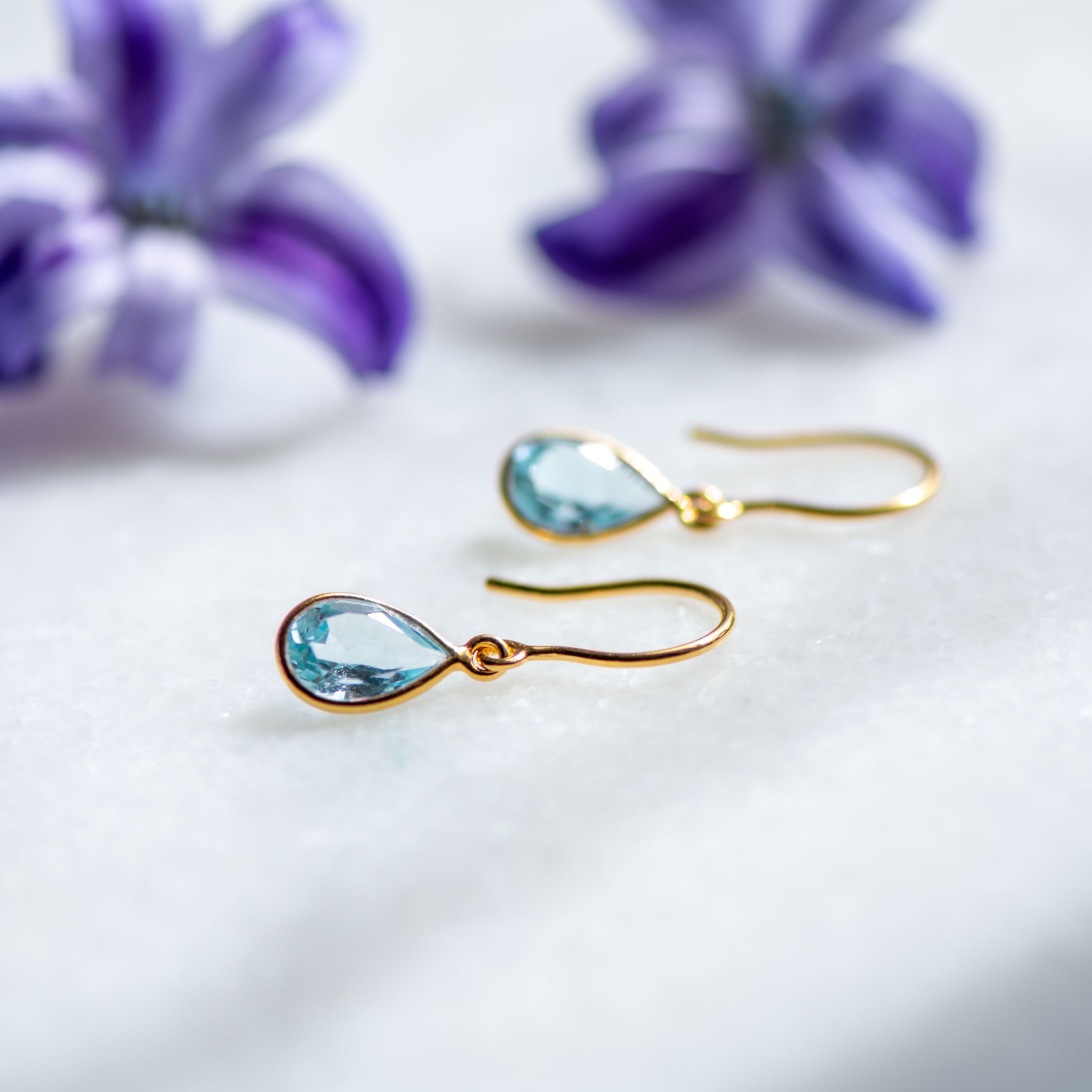 blue topaz tear gold drop earrings from memara