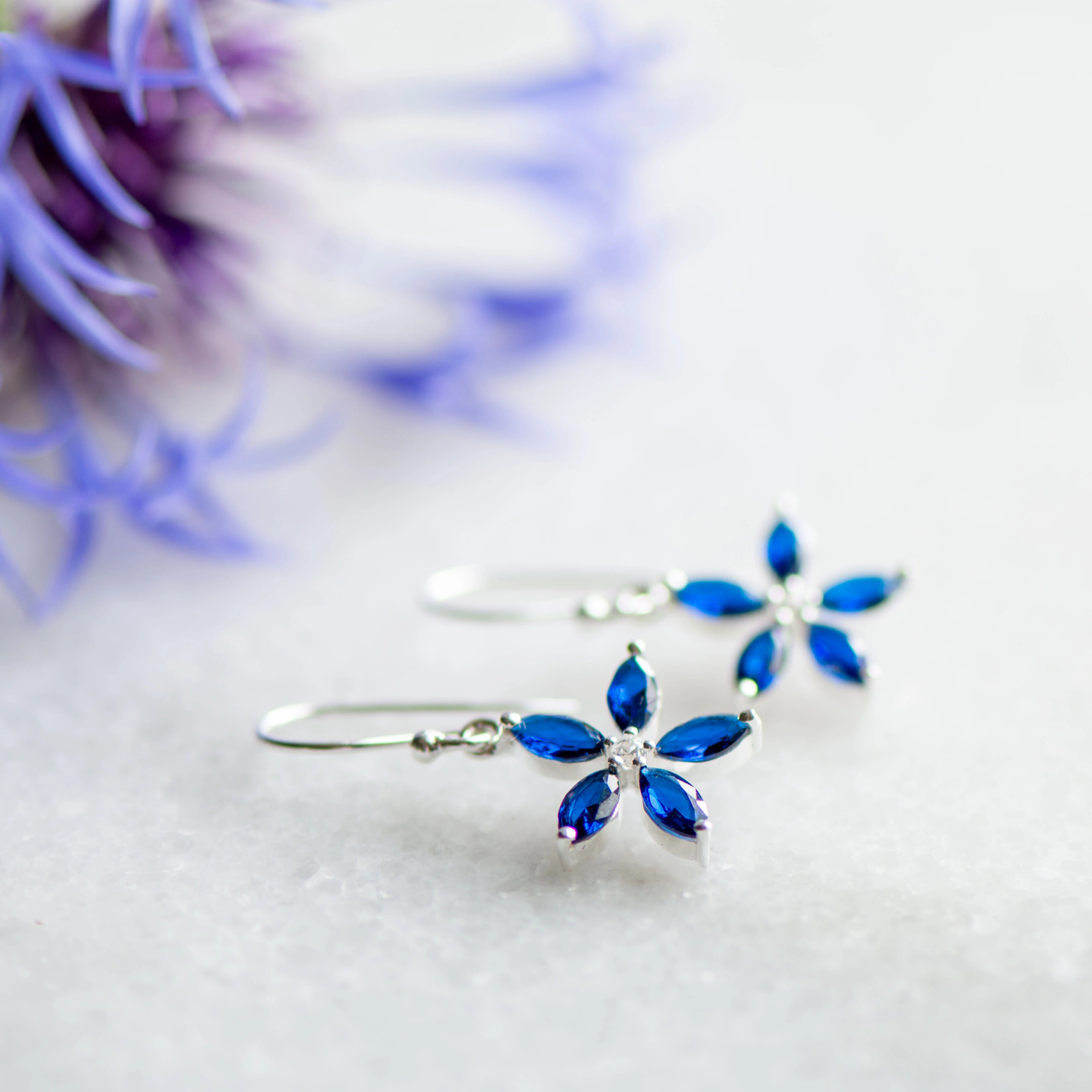 Blossom Drop Earrings in Silver with Sapphire and White Zirconia from Memara