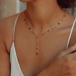 the Y Drop Necklace in Garnet from Memara