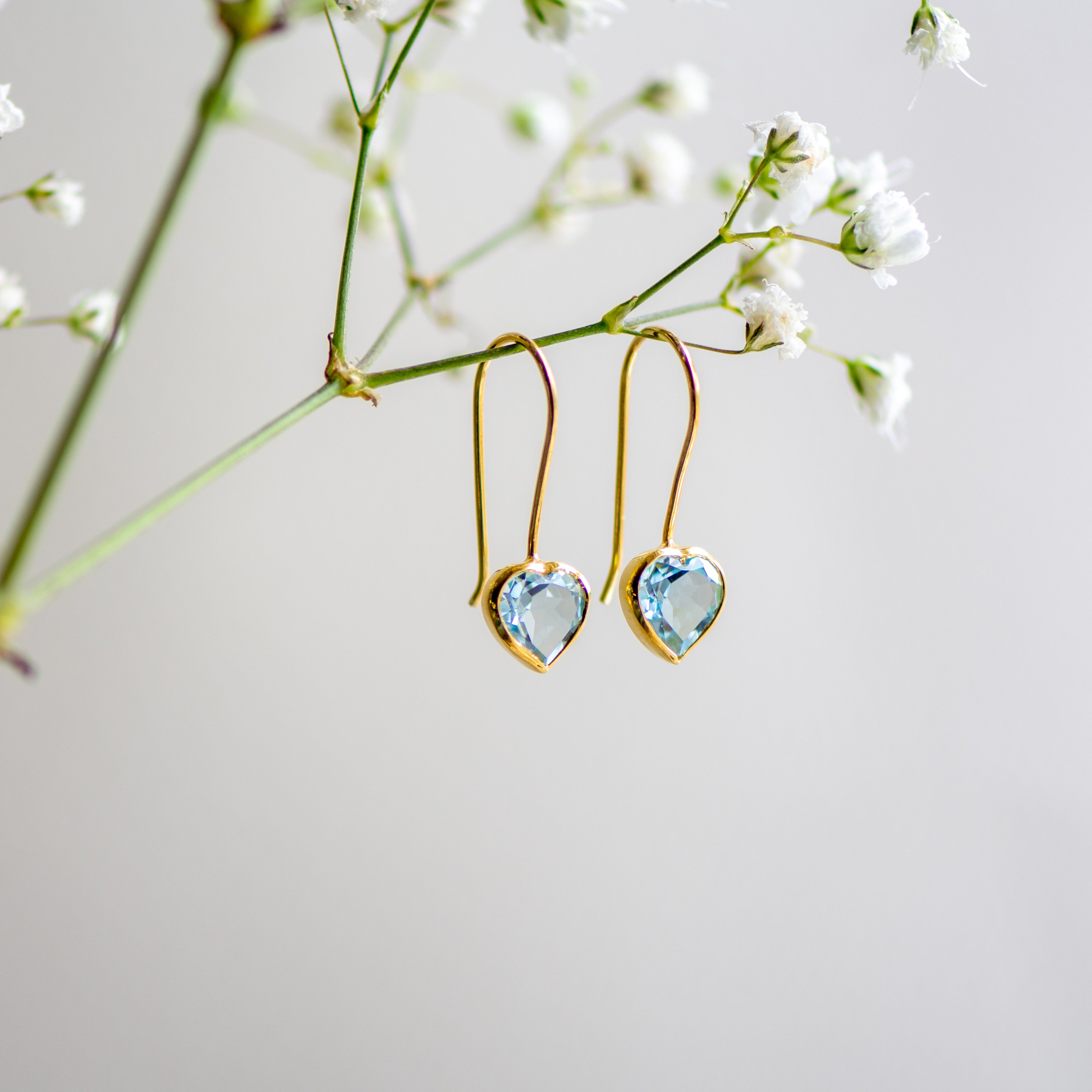 blue topaz gold heart drop earrings from memara
