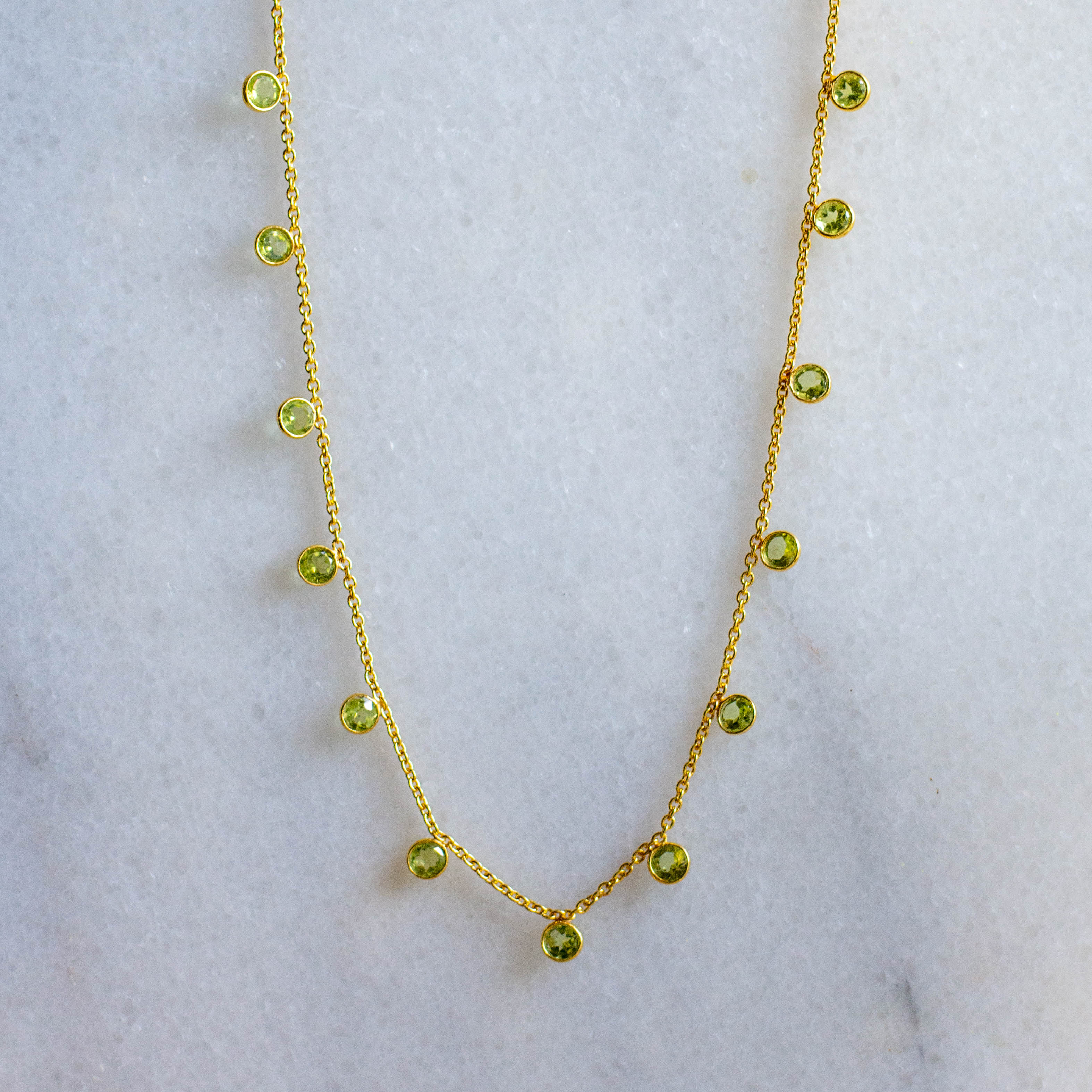 zaza gold necklace with peridot from memara